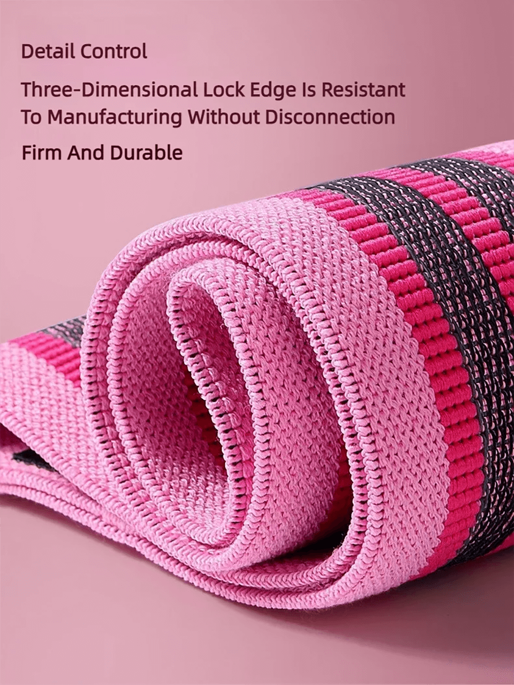 Close-up of pink fabric resistance band with three-dimensional lock edge, emphasizing durability and non-slip design for fitness workouts.